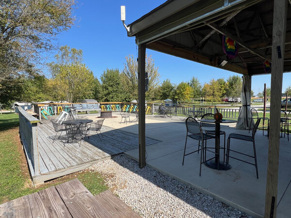 Covered patio and deck with the fire pit